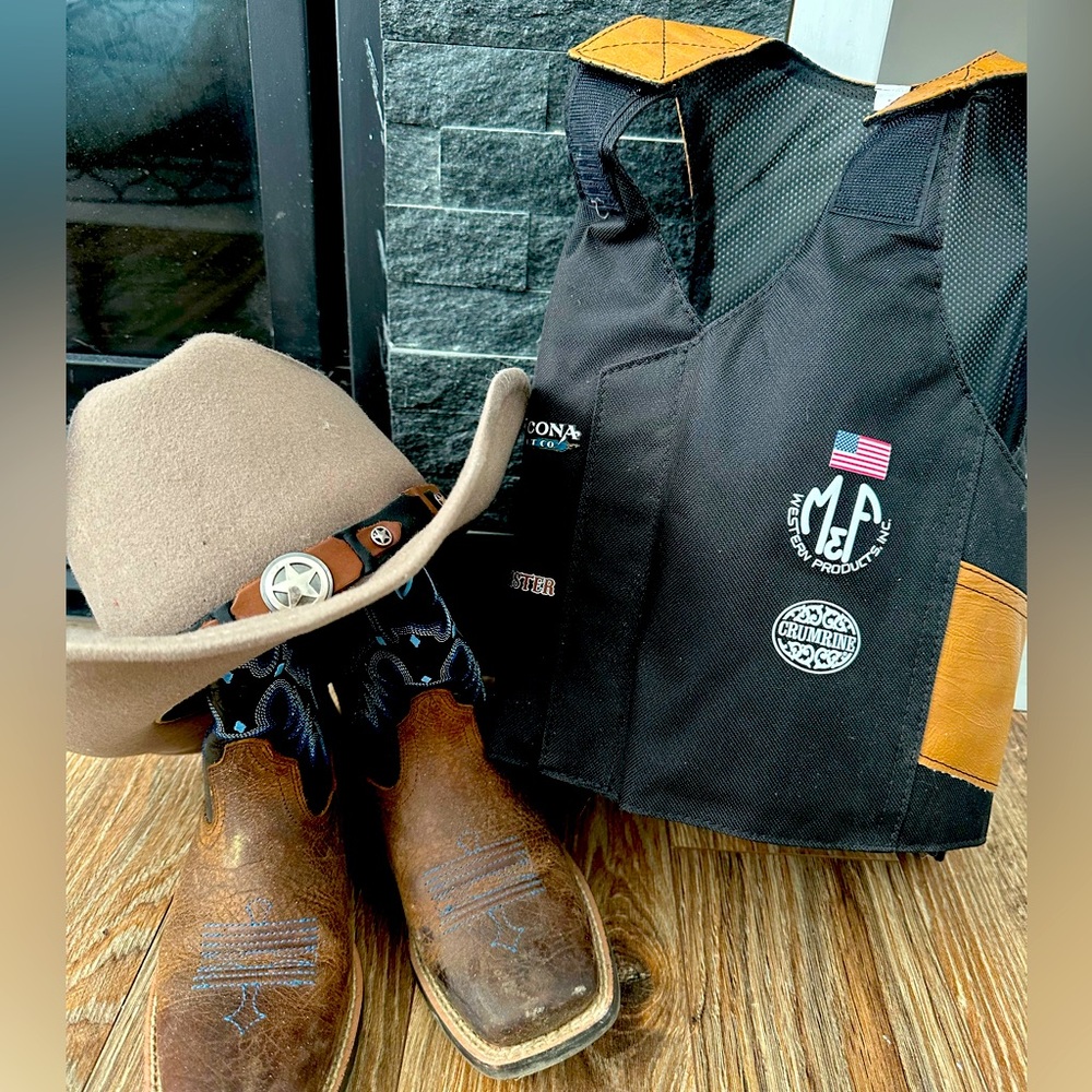 Set of kids cowboy boots, hat and vest size large.